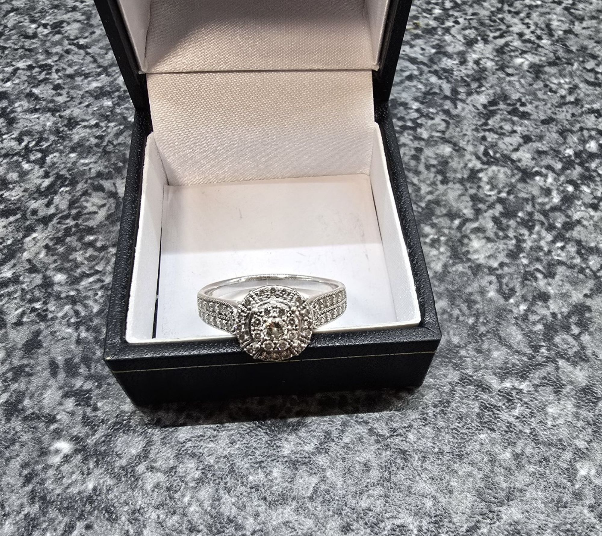 White gold cluster of diamonds ring