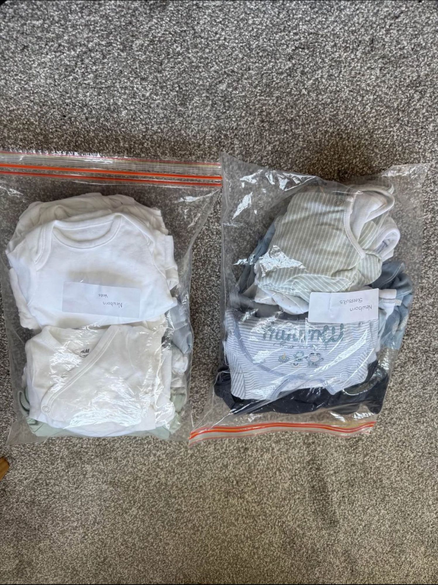 Newborn sleepsuits and vests