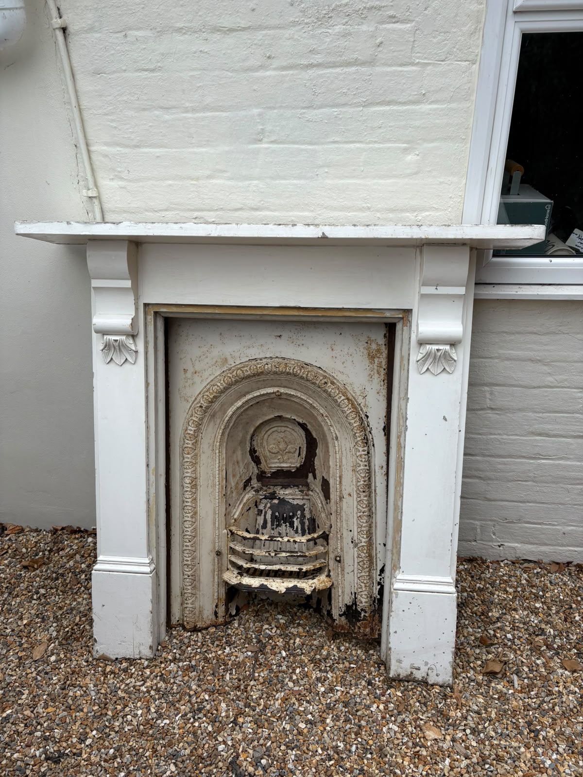 Wooden fireplace with grate